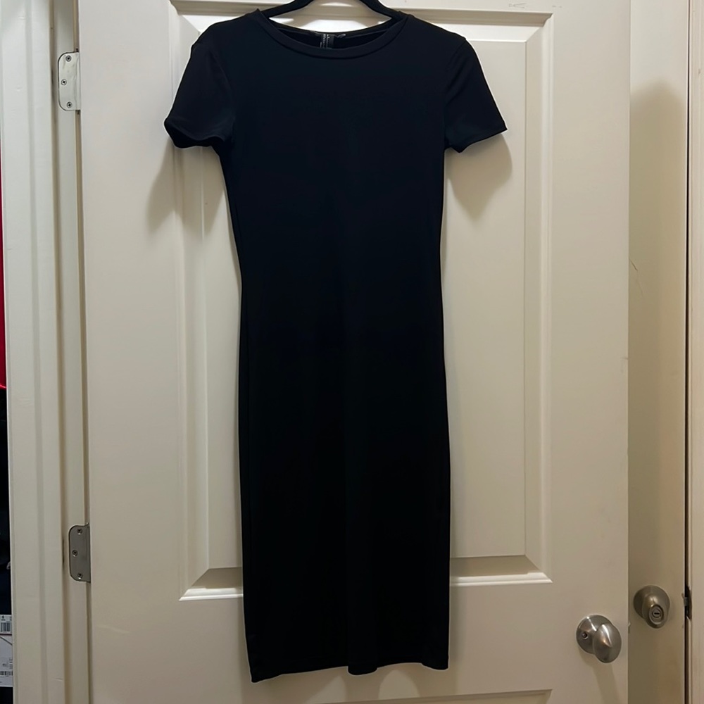 Forever 21 long short sleeve dress. Stretchy material with slit in the back.